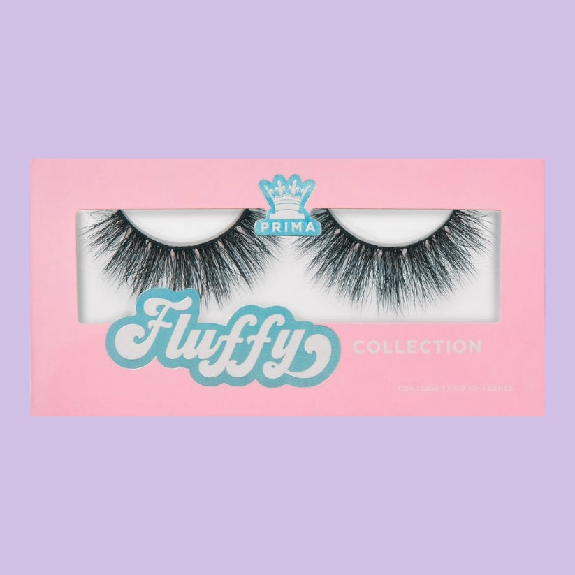 Packaging of Fluffy 5D Wispy Lashes with the product visible, displayed on a pink background with the brand name and 'Vegan' label.