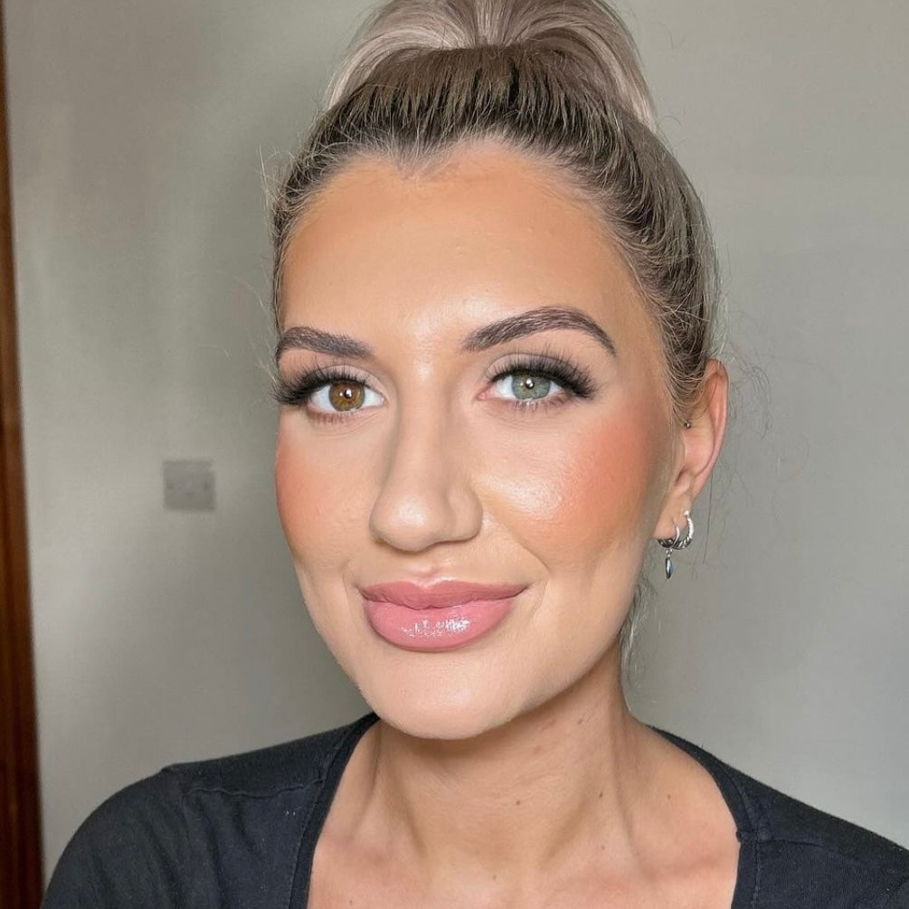 Model wearing PrimaLash #Shook mink lashes – soft, fluttery strip lashes styled to resemble classic lash extensions for a natural glam look.